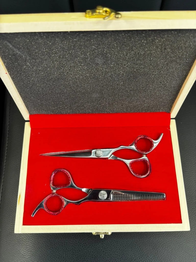 Professional texturizing and thinning scissors used for blending tapers and removing bulk.